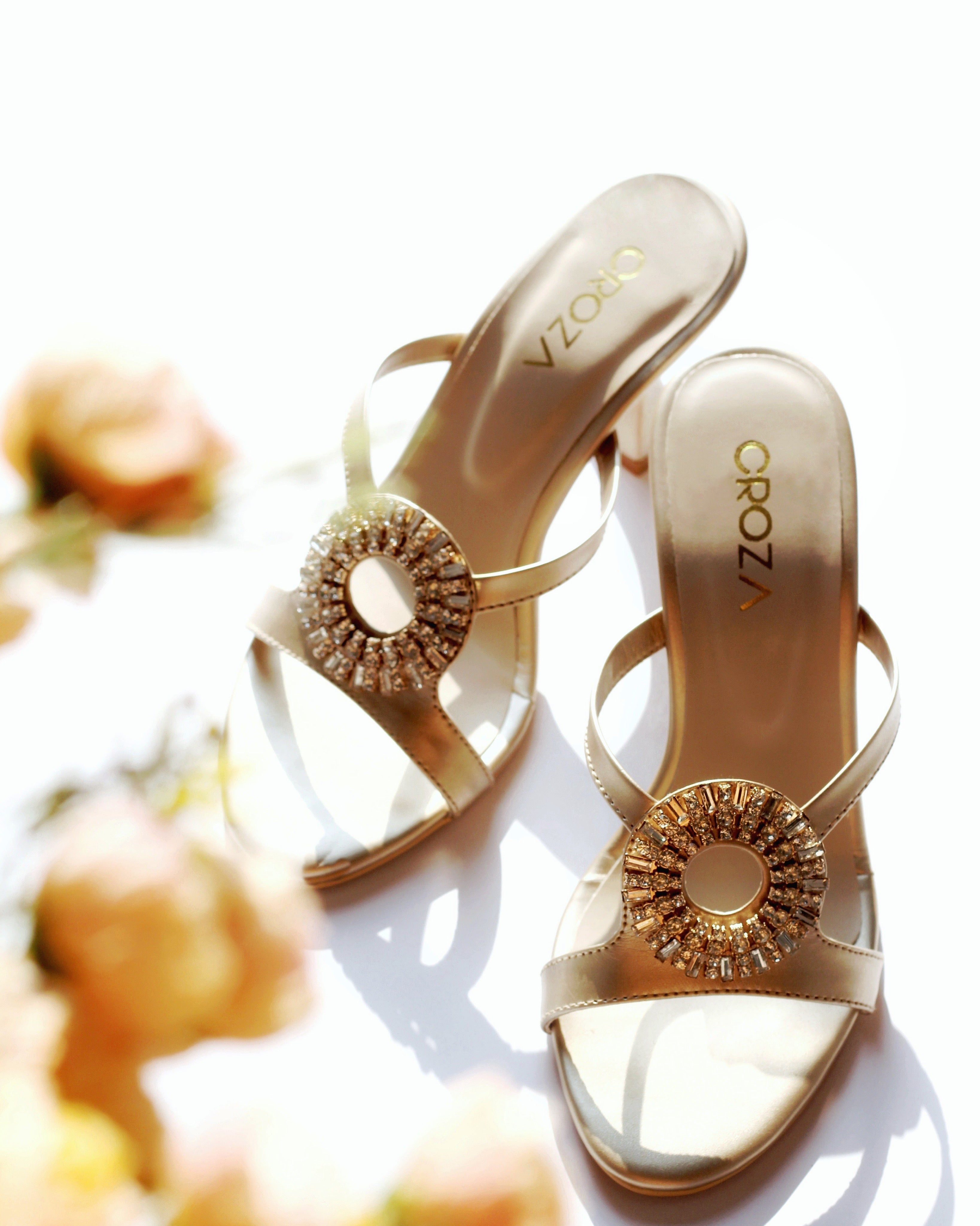Golden heels with brooch