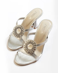 Silver heels with brooch