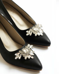Black court heels with brooch