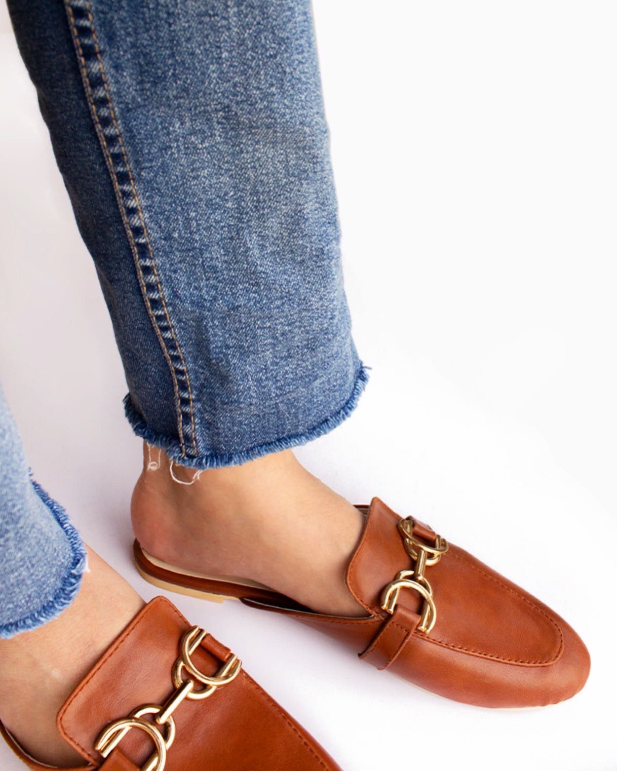 Brown mules with gold accessory