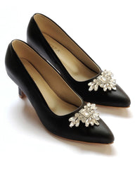 Black court heels with brooch